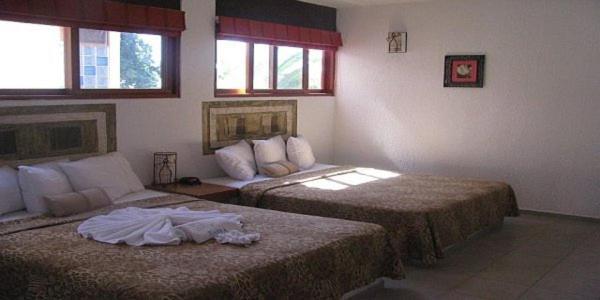Hotel Villas Xaiba ปูแอร์โตเอสกอนดิโด ห้อง รูปภาพ